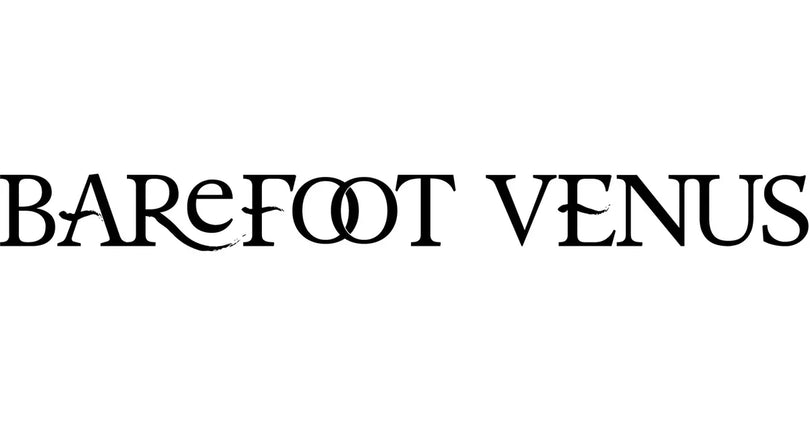The Barefoot Venus logo features elegant black serif lettering with artistic flourishes, including stylized curves on the “R,” “E,” and “N,” and interlocking “O”s in “FOOT,” creating a graceful and feminine visual identity.