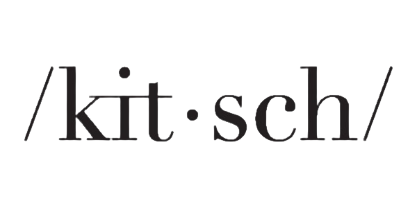 The Kitsch logo features the brand name "Kitsch" presented in a black serif font with a phonetic style including small dots and slashes, giving it a clean and modern look. 