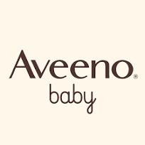 The Aveeno Baby logo features the word “Aveeno” in a clean, modern brown font with “baby” written in a smaller, playful, lowercase script underneath on a soft beige background.