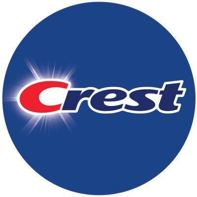 The Crest logo features bold white and red text on a blue circular background with a radiant glow behind the red "C," symbolizing brightness and cleanliness.