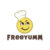The FreeYumm logo shows a smiling yellow face wearing a white chef’s hat, with “FREEYUMM” written in bold brown letters underneath.