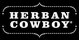 The Herban Cowboy logo shows bold white text in a western-style font on a black background with a dotted border, giving it a rugged look.