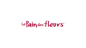 The Le Pain des Fleurs logo features the brand name in a handwritten-style lowercase font in deep red, giving it a natural, friendly, and artisanal feel that reflects its organic food identity.