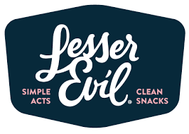 This is a logo image of LesserEvil, featuring the words 'Lesser Evil' in stylized white script font on a dark navy blue shield-shaped background, with the phrases 'Simple Acts' and 'Clean Snacks' in small pink text on either side.
