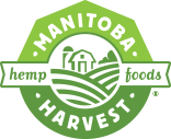 The Manitoba Harvest logo features a green badge with a farmhouse and field icon, with the words “Manitoba Harvest” and “hemp foods” in bold white text.