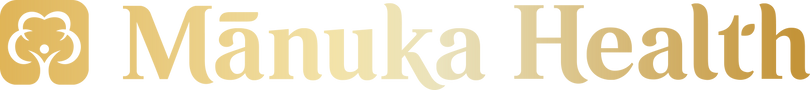 The Manuka Health logo features a golden honeycomb-inspired flower icon beside the brand name “Mānuka Health” in elegant, gradient gold lettering on a transparent background.