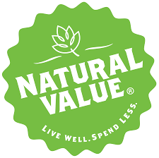 The Natural Value logo is a green circular badge with the words “Natural Value” in bold white letters and the slogan “Live Well. Spend Less.” beneath a simple leaf icon.