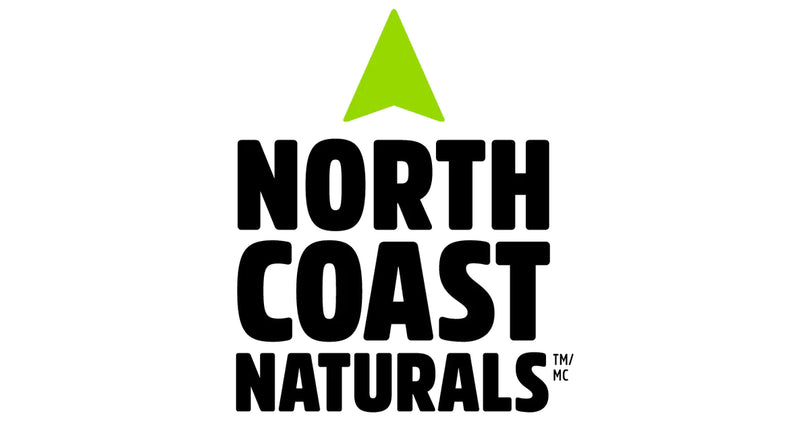 North Coast Naturals logo features bold, black uppercase text stacked vertically—“NORTH COAST NATURALS”—with a bright green upward-pointing triangle above the name, symbolizing growth and vitality.