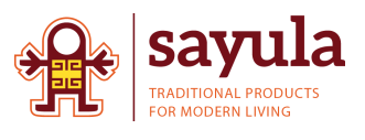 The logo features a small stylized figure in warm red and gold tones on the left, followed by the word “sayula” in bold lowercase letters, with the tagline “Traditional Products for Modern Living” underneath on a white background.