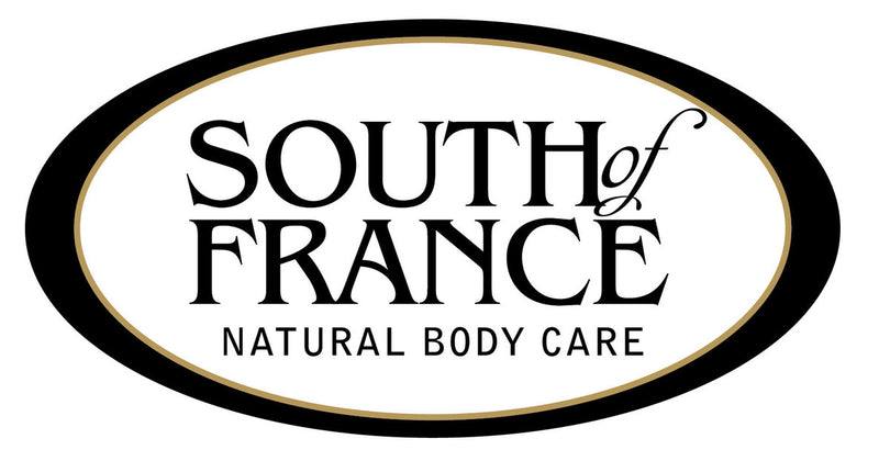 The South of France logo features elegant black serif text reading "South of France Natural Body Care" centered inside a white oval with a black and gold border, reflecting a clean and refined brand image.