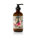 Barefoot Venus Ruby Red body cream in an eight ounce amber glass bottle with a black pump dispenser.