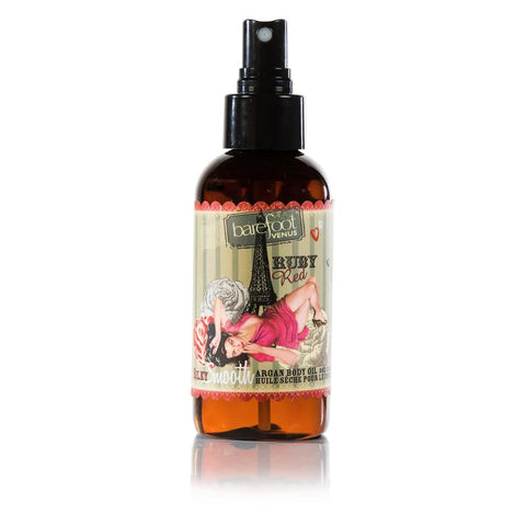Barefoot Venus Ruby Red silky smooth argan body oil in a five ounce amber glass bottle with a black spray nozzle.
